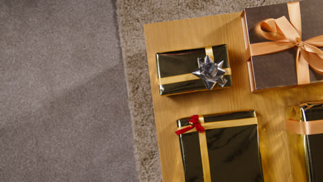 Overhead-Shot-Of-Gifts-Or-Presents-Wrapped-On-Table-At-Home-2